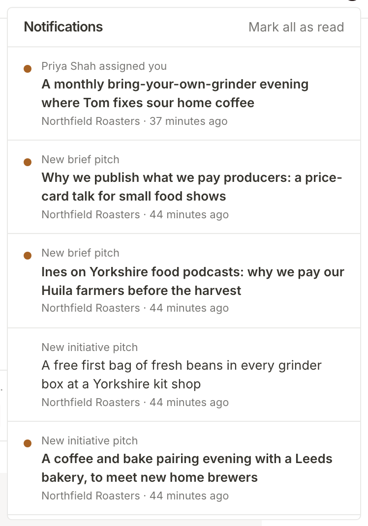 Tom's Notifications, opened from the topbar: an unread notice that Priya Shah assigned him the grinder evening, above new brief and initiative pitches